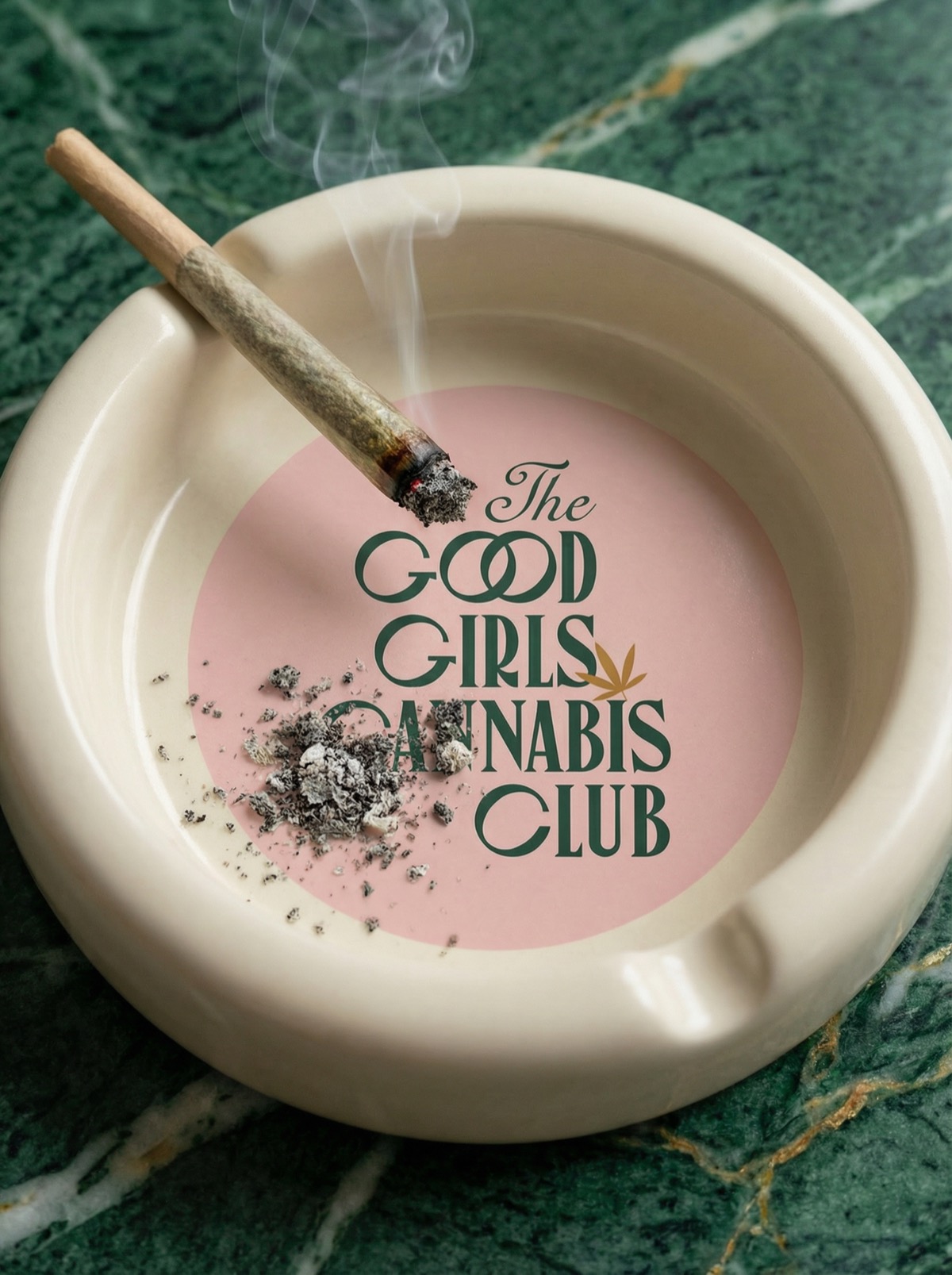 GGCC — branded ashtray with lit joint