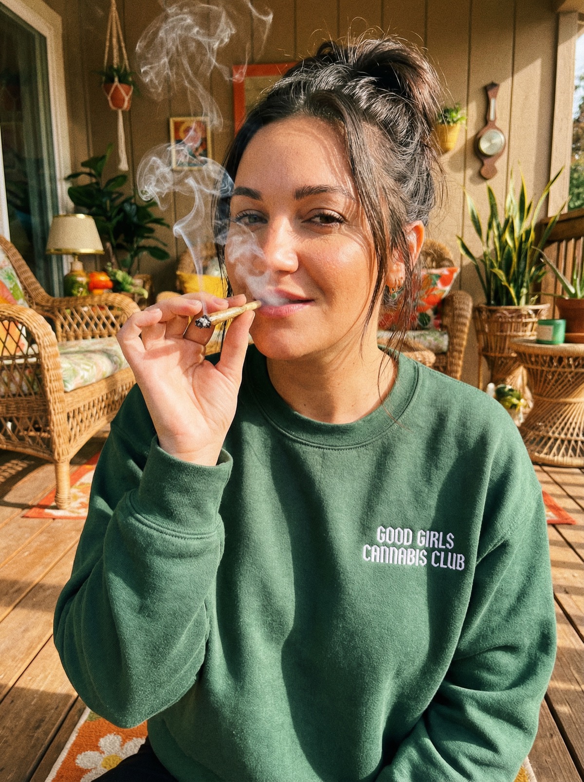 Woman in GGCC crewneck on porch